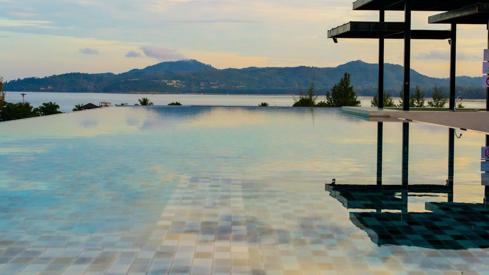 Creating a Tranquil Ambience with Landscaping Around Your Infinity Pool